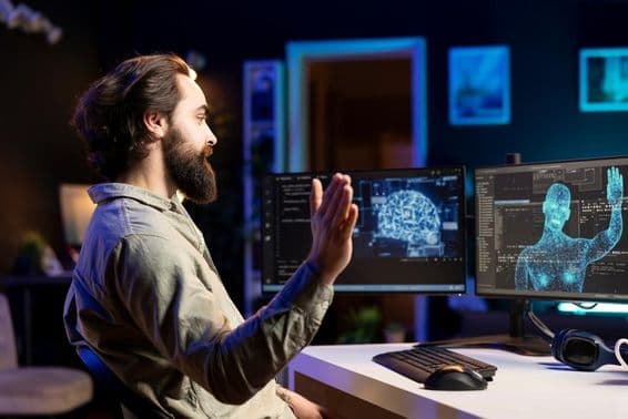 اے آئی پروگرام کو کوڈنگ کرتے ہوئے انسانی شکل کو مانٹر پر دیکھا جا رہا ہے۔