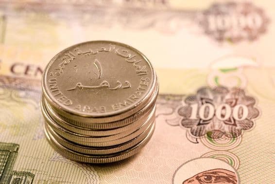 متحدہ عرب امارات کی کرنسی: 1000 درہم کا نوٹ اور 1 درہم کا سکہ۔