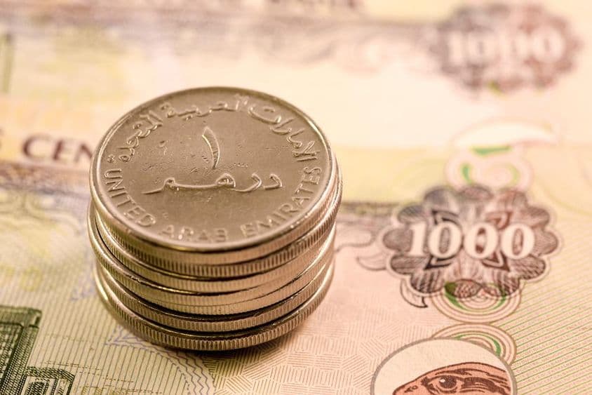 متحدہ عرب امارات کی کرنسی: 1000 درہم کا نوٹ اور 1 درہم کا سکہ۔